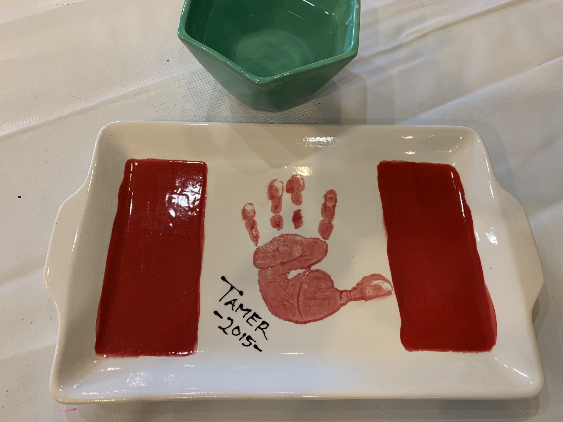 Hand print in a clay tray