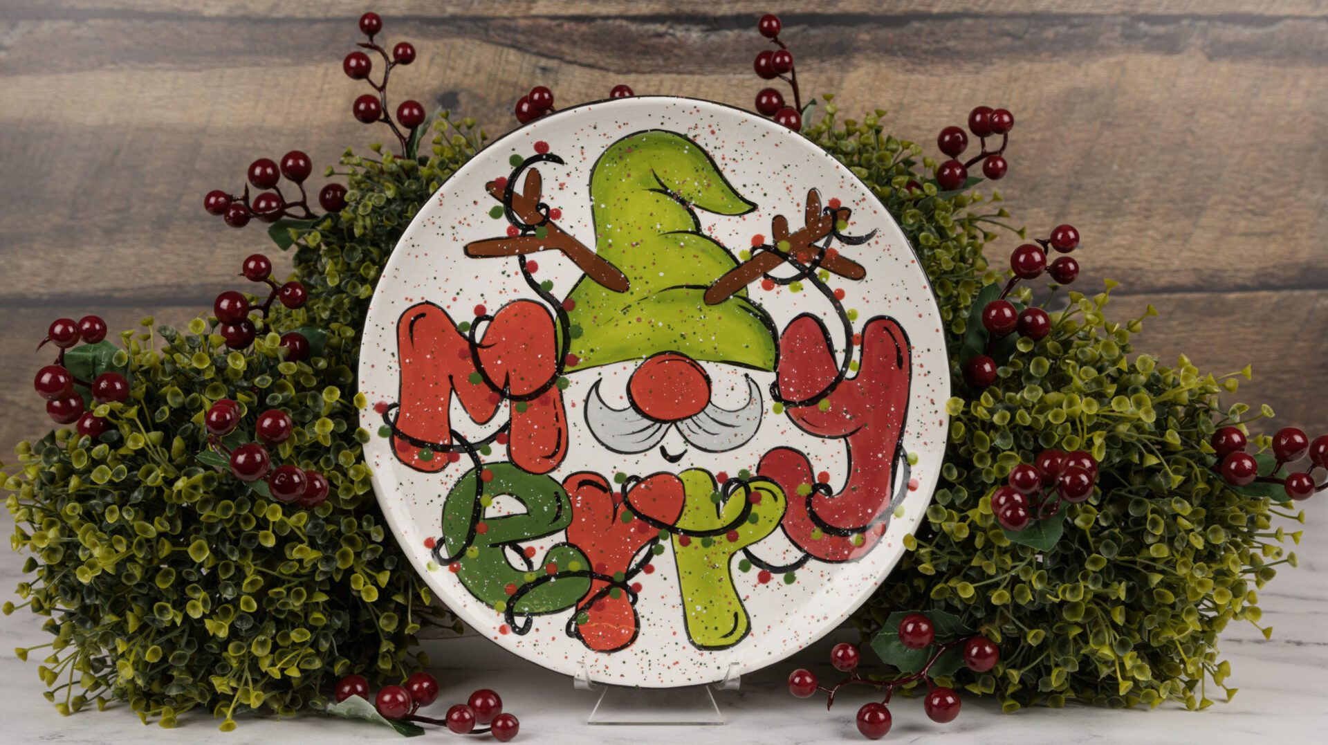 a plate painted with a winter gnome