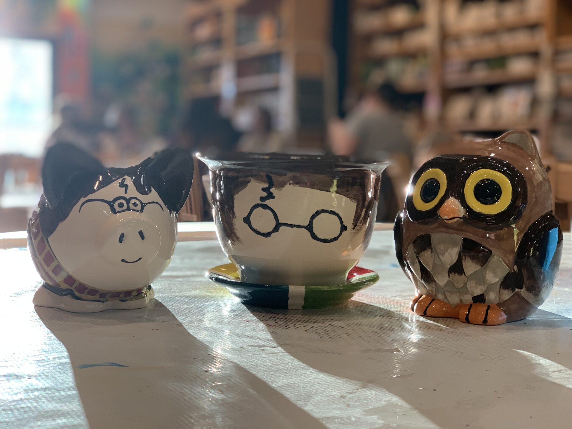 Clay mugs and tea cups with different designs