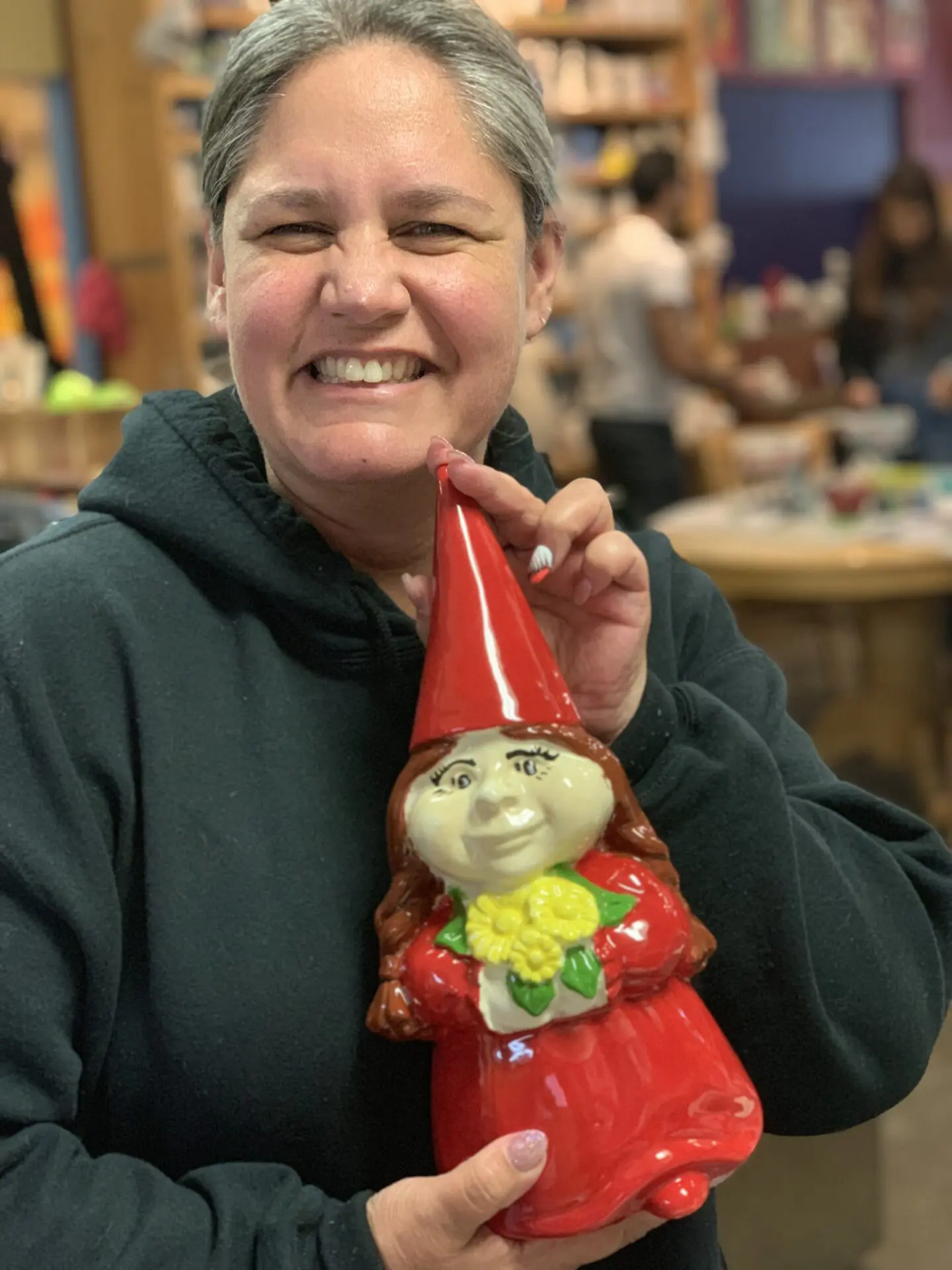 Lady holding a clay toy